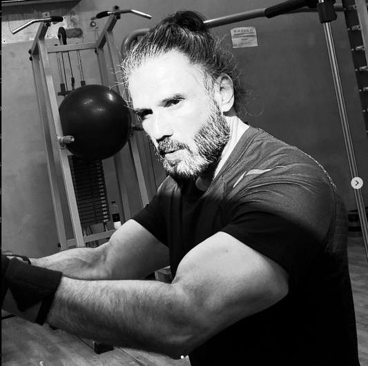 Suniel Shetty showcasing his muscular and fit body in a gym workout