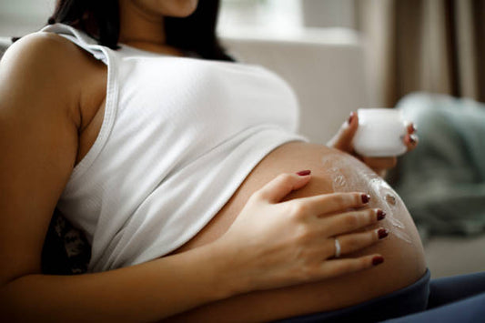 How can new moms effectively manage stretch marks or skin changes post-pregnancy?