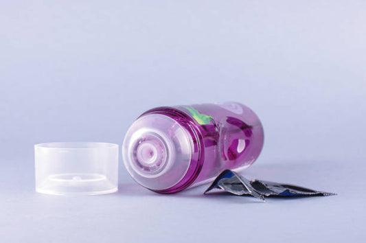 Can you explain the difference between water-based and oil-based lubricants, and which is suitable for use with condoms?